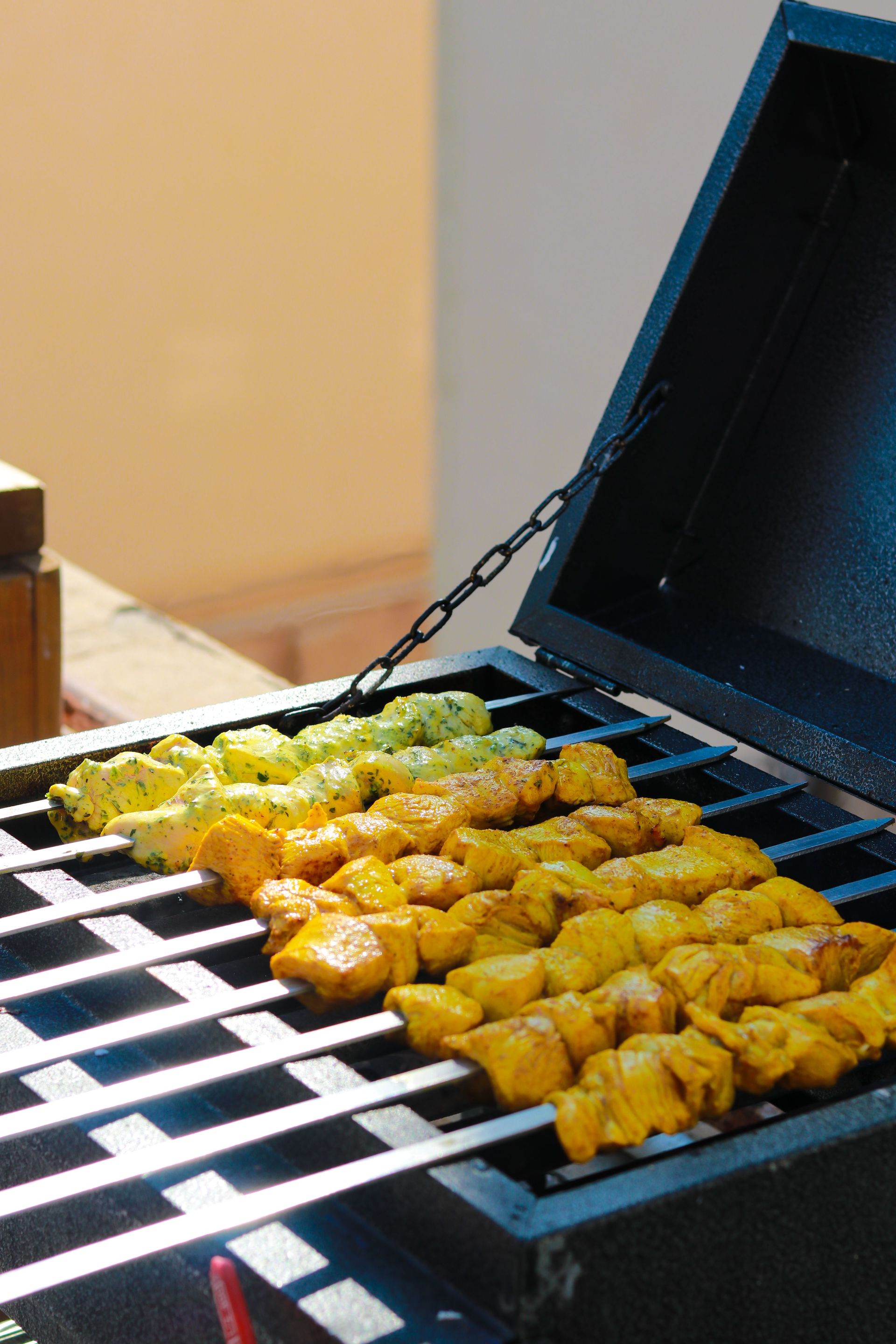 Juicy chicken skewers grilling outdoors, showcasing savory flavor